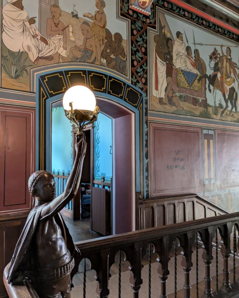 Paintings depicting Ethiopia in a hallway at Château d'Abbadia