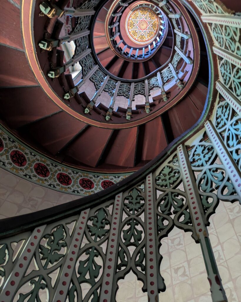 Ornate spiral staircase inside Château d'Abbadia